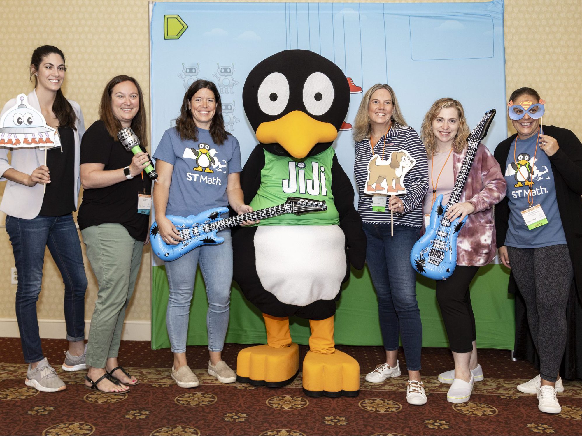Photo of educators with JiJi at Champion Day Conference